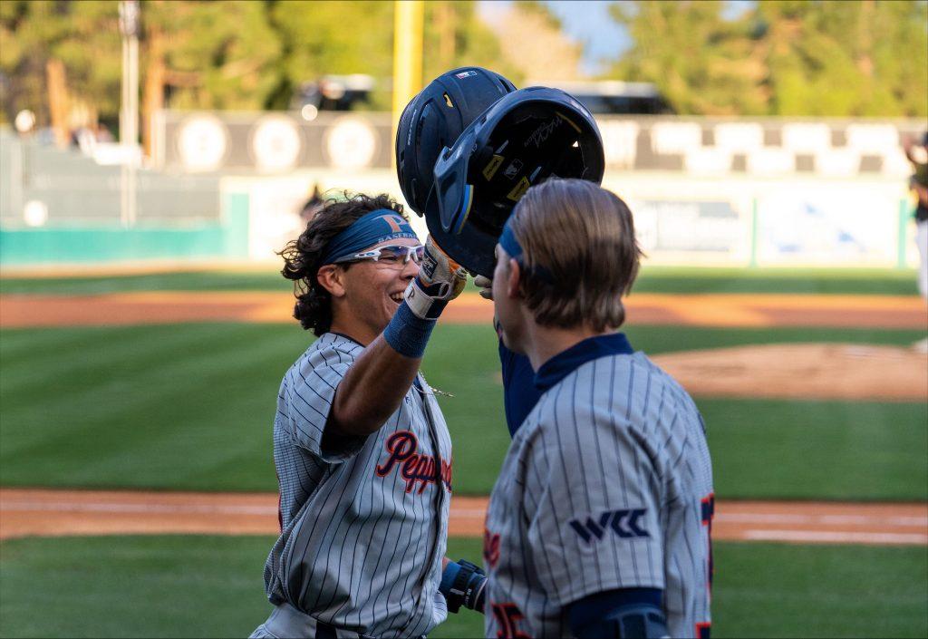 Freshman catcher/utility Esteban Sepulveda celebrates against California State University, Long Beach at Bohl Diamond at Blair Field on March 11. Sepulveda hit the first home run of his Pepperdine career against Long Beach. Photos courtesy of Mark Siquig/Long Beach Current