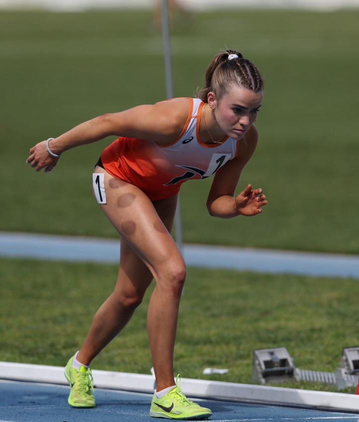 Bruner takes the starting line at Stotsenberg Track on April 6. Bruner said during her semester abroad, she dealt with recovering without the help and support of her teammates across the globe. Photo courtesy of Hannah Bruner