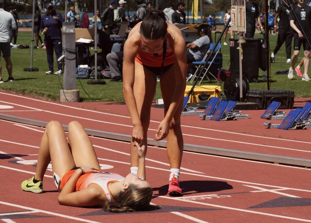 Hannah Bruner, sophomore cross country and track athlete—recovers after a race at the University of California San Diego on April 6. Bruner said her teammates are what fueled her love for the sport and got her through the challenges her injury posed. Photo courtesy of Hannah Bruner