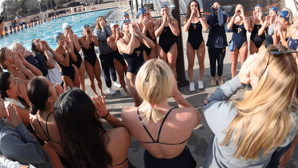 Members of the Women's Swim and Dive team gather in a huddle after their last win over Azusa Pacific 184-116 on Jan. 24 and 25, at Raleigh Runnels Memorial Pool. Assistant coach Monique Demaisip highlights how important family is when it comes to winning. Photo courtesy of Pepperdine Athletics