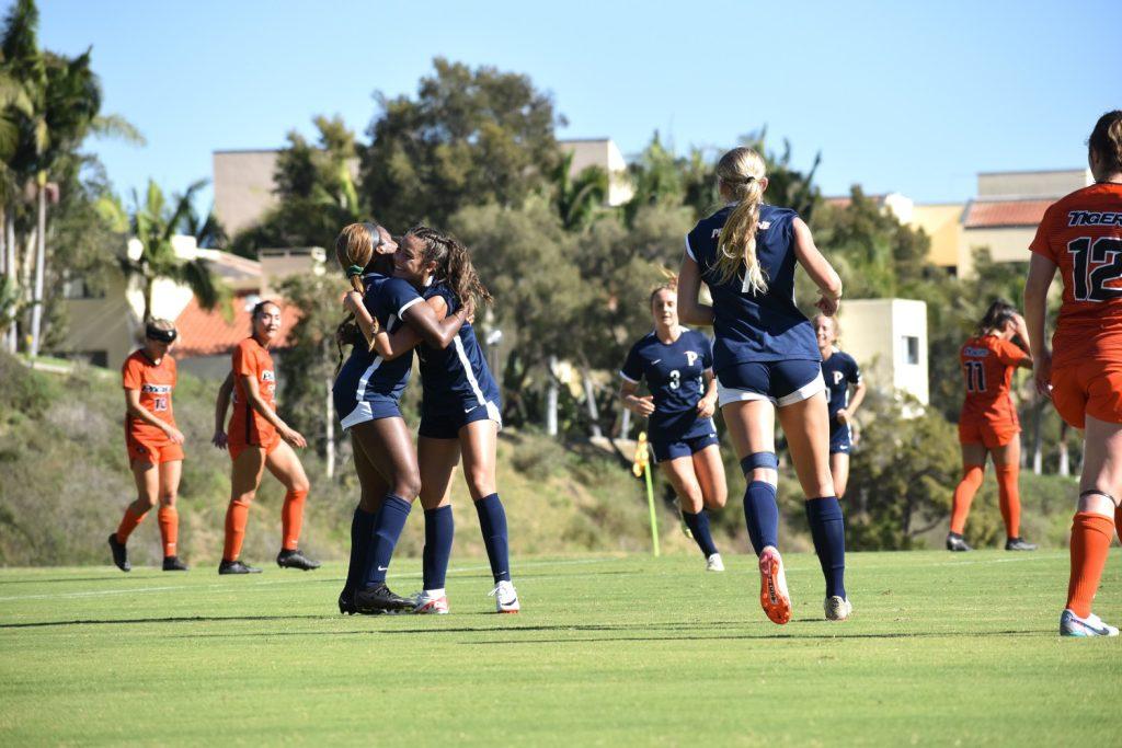 Midfielder Julianna Duckett ('24) helps forward Julia Quinonez celebrate her first WCC goal Oct. 4, 2023 at Tari Frahm Rokus Field. Quinonez’s shot broke the Waves' streak of over three halves without a goal. File photo by Mary Elisabeth