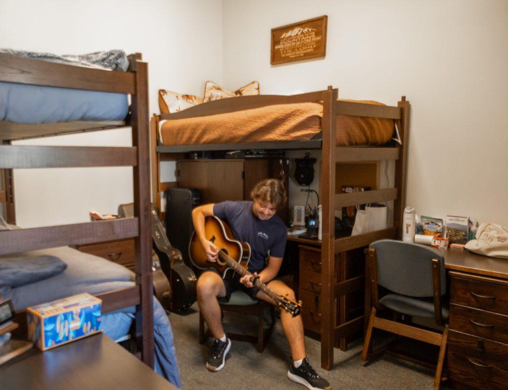 Thomas playing guitar
