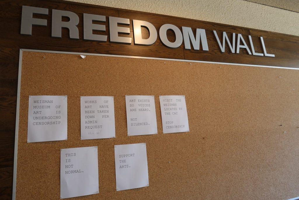 Flyers pinned on the Freedom Wall address the censorship at the Weisman Museum on Oct. 9. The questions, "Which ones?" is written on a flyer describing how Pepperdine administrators directed the removal of artwork in the Museum. Photo by Haylie Ross