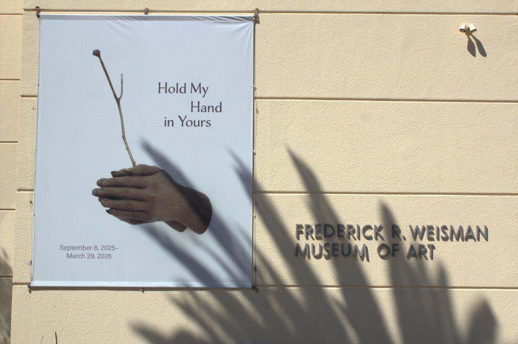 A palm tree&squot;s shadow is cast onto the side of the Weisman Museum on Oct. 3. The "Hold My Hand in Yours" exhibition was originally scheduled to be on display until March 29, 2026. Photo by Griffin Pilcher