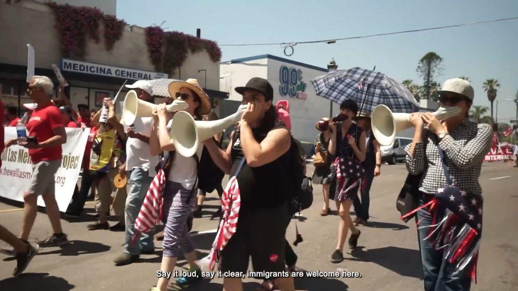 Performance artists march during the 2017 May Day protest in Downtown Los Angeles in a segment from "Call to Arms, 2015-2025." The segment of the video is the only part Mann says she believes has "overtly political" content. Video image courtesy of Elana Mann