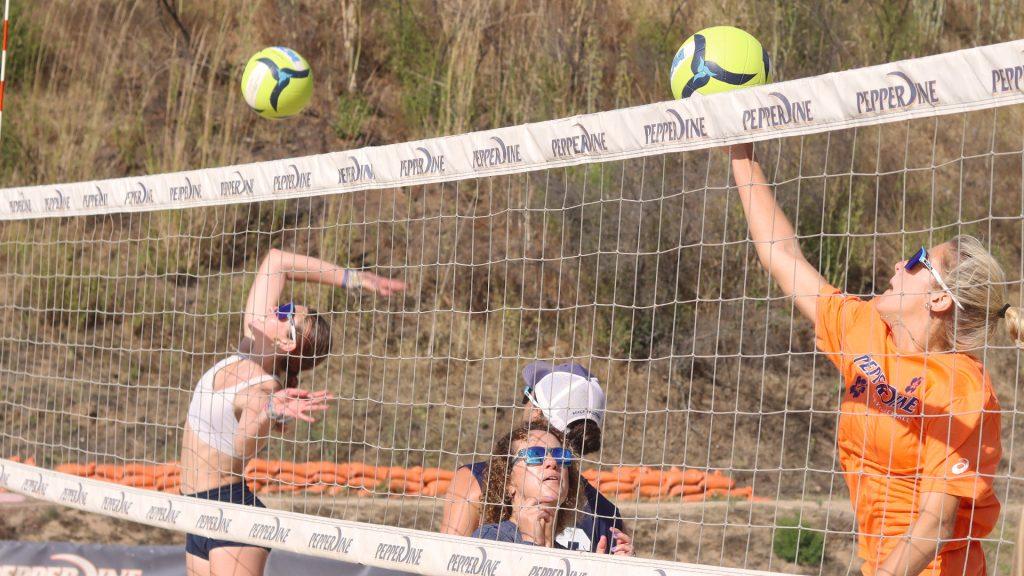 Redshirt senior Emma Bubelis (left) and sophomore Tippi Lane (right) jump to spike the ball during a competitive practice on the Marie Canyon Courts on Oct. 3. Moments like this highlighted the effort and concentration that fueled the Waves through the preseason.