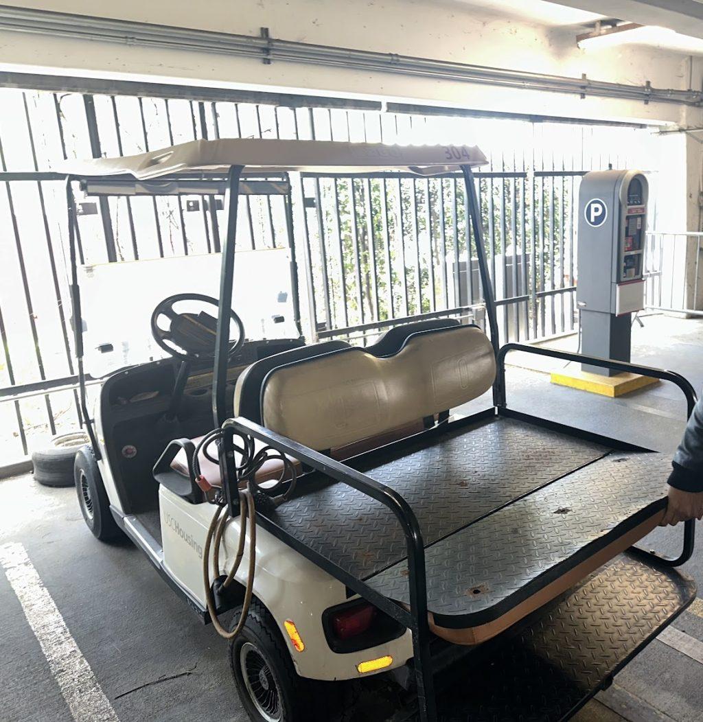 A USC golf cart with a pull-out backseat, which allows for students to fully extend their legs, is parked on USC's campus April 15. This option can help injured students ride comfortably to class.