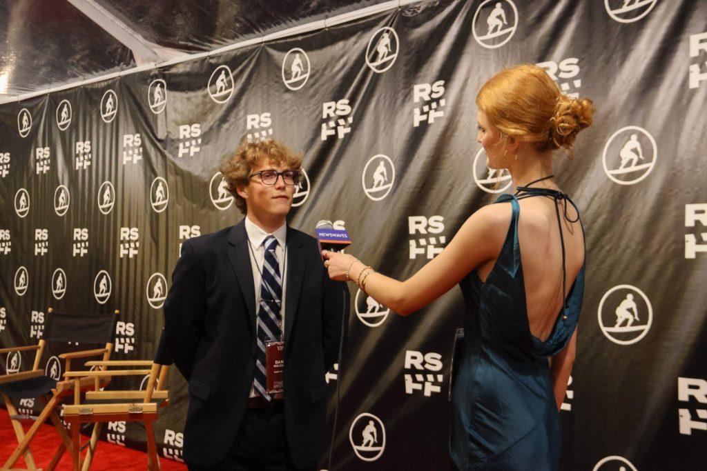 NewsWaves reporter Kaiya Treash interviews senior Dane Malzahn on the RSF17 red carpet at Lower Mullin Town Square on Feb. 6. Malzahn said documentary filming can be difficult because the schedule has to be sporadic.
