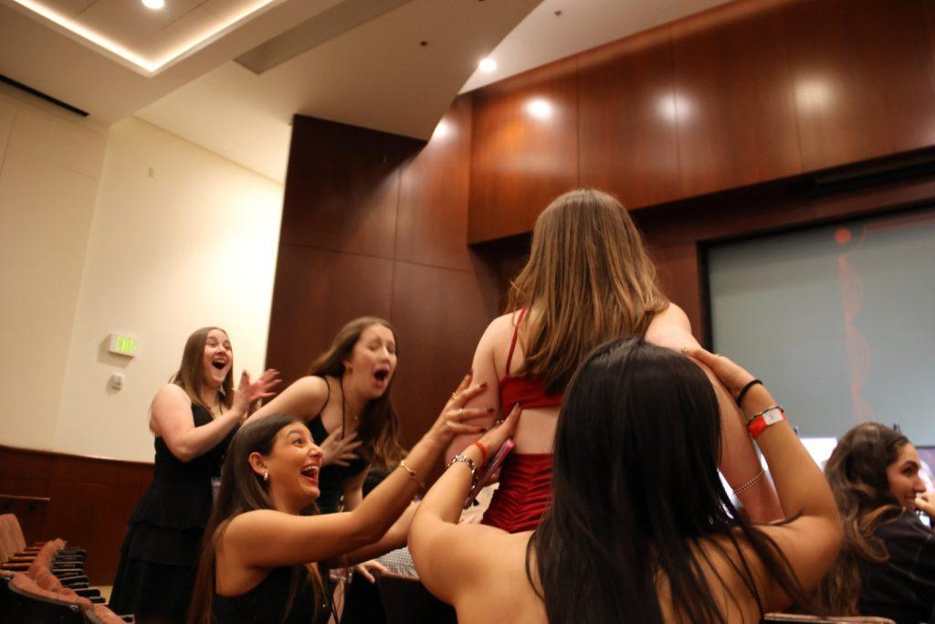 Senior Isabelle Harris stands to accept the award for Best Picture in Smothers Theatre on Feb. 6. Harris said her film taught her to rely on other people.