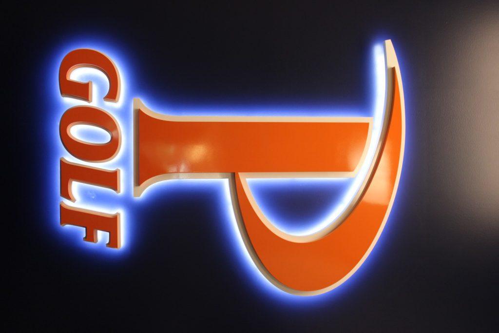 The Pepperdine Golf logo is displayed inside the golf clubhouse.