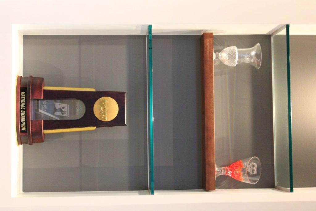 A national championship trophy is displayed inside the Golf Clubhouse.